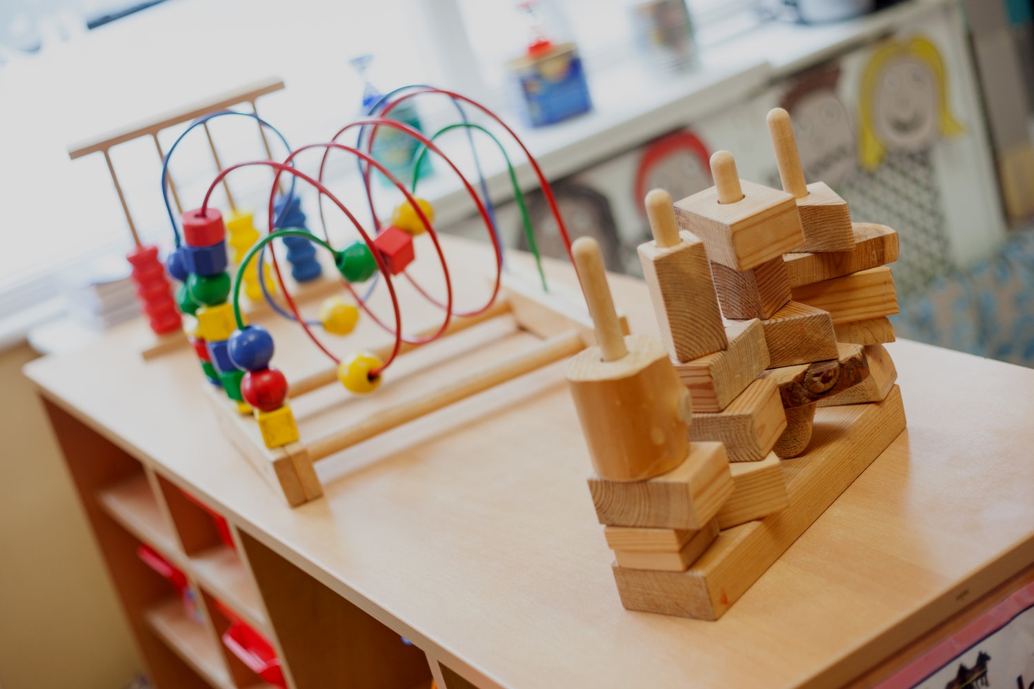 Kindred Little Learners An image of some activity maze and puzzle toys for babies and toddlers