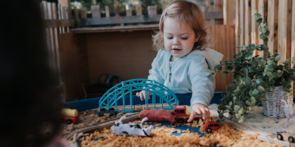 Young child playing with toys at Nursery - Nursery Funding